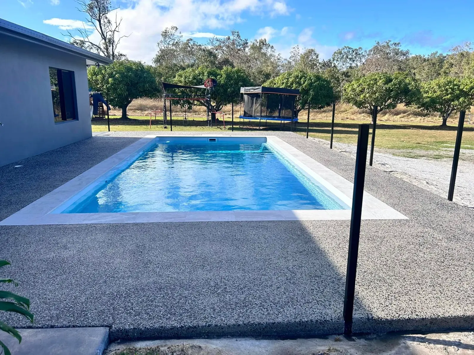 Finished concrete pool surround at a residential property